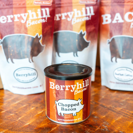 A can of Berryhill Chopped Bacon in front of packages of bacon with a pig graphic and the text 'BACON'.