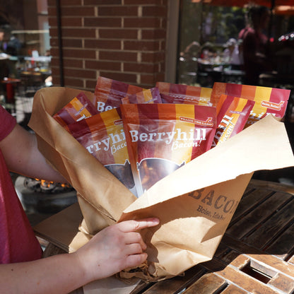 Person holding a box of Berryhill coffee bags outdoors